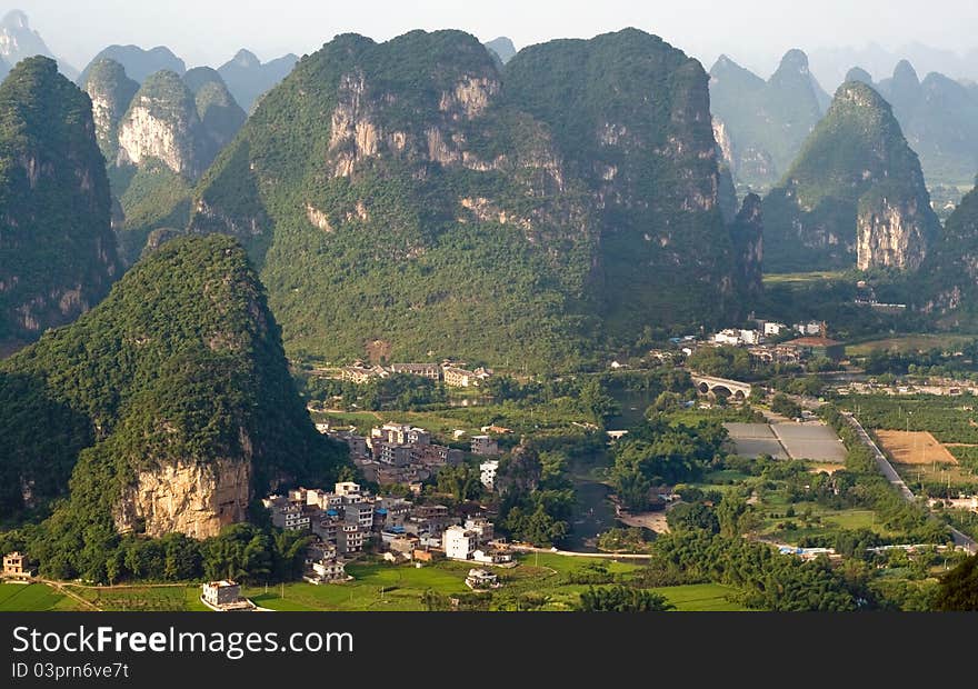 Aerial view image of Guilin village at sunset from Moon Hill mountain. Yangshuo, China, Asia