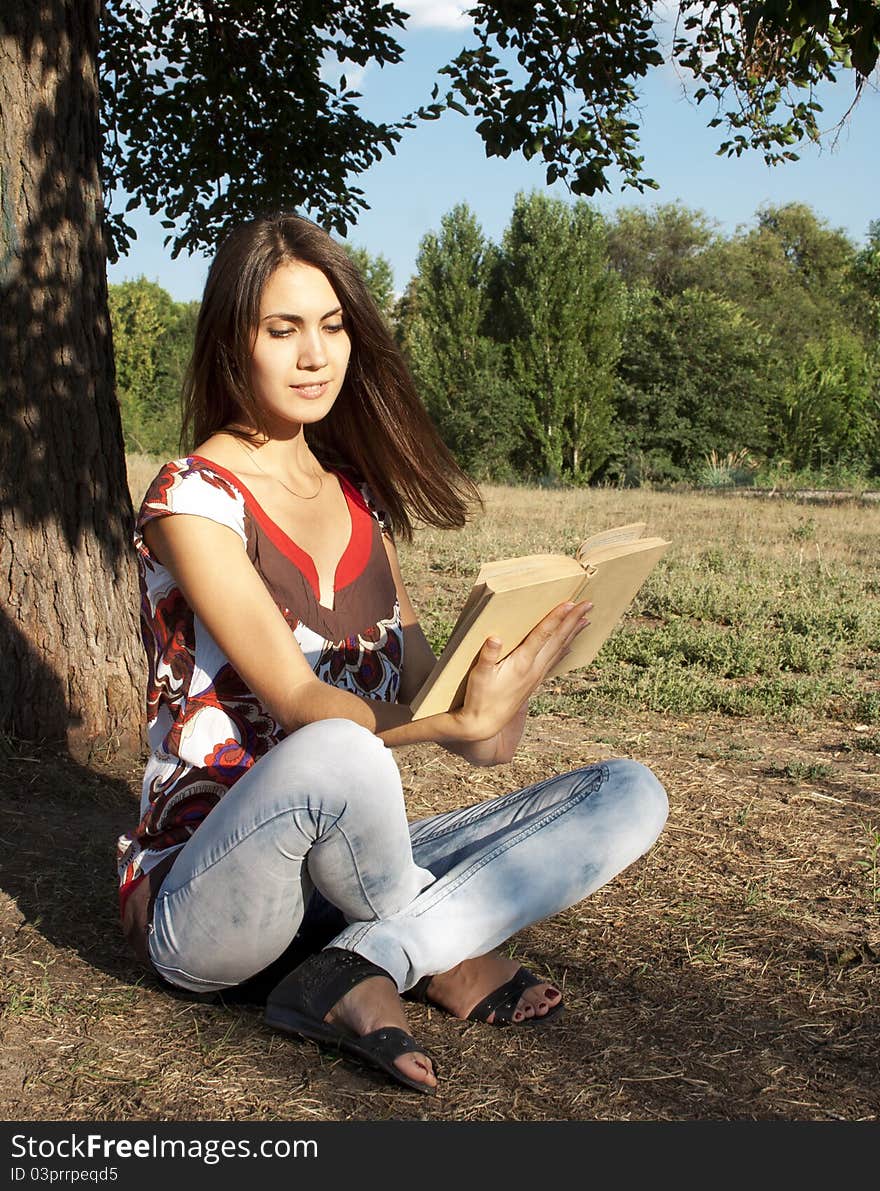 Adult girl reading a book