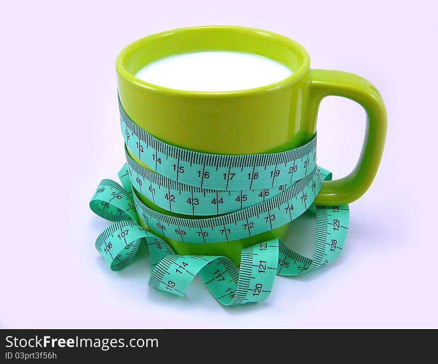 Cup of Kefir with a Tape Measuring on a White Background as Concept of Kefir Diet