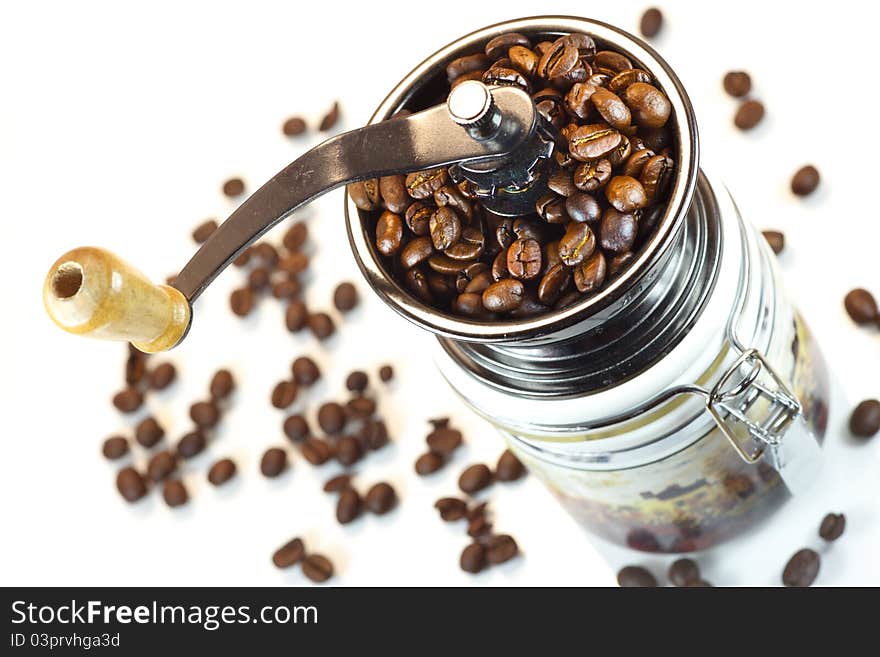 Manual coffee mill on white background