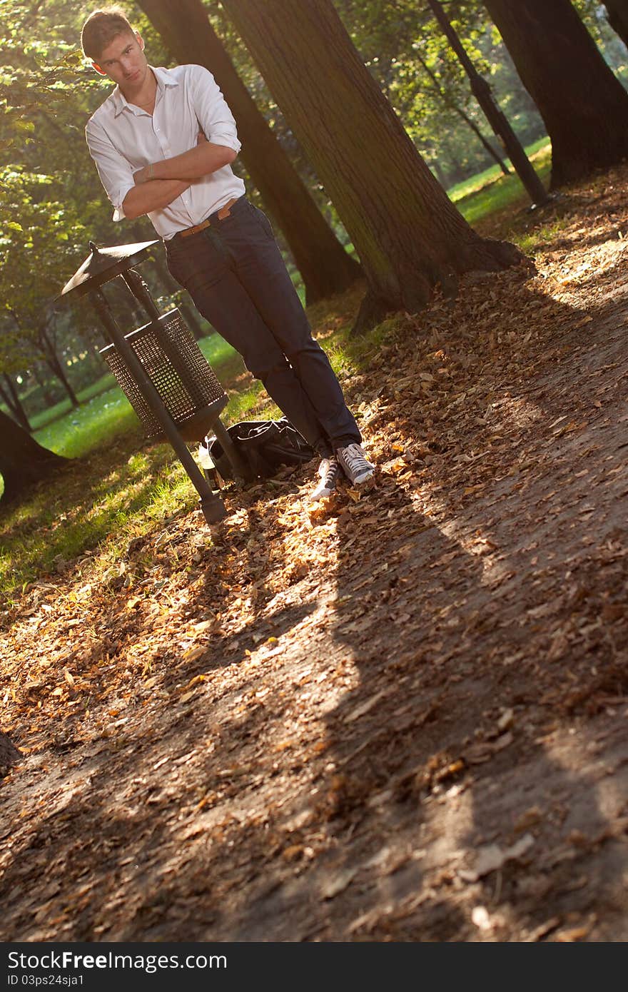 Angry business model in the park at sunrise. Angry business model in the park at sunrise