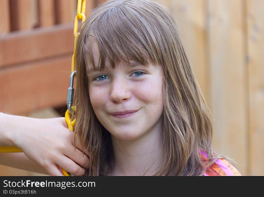 Young girl on a swing