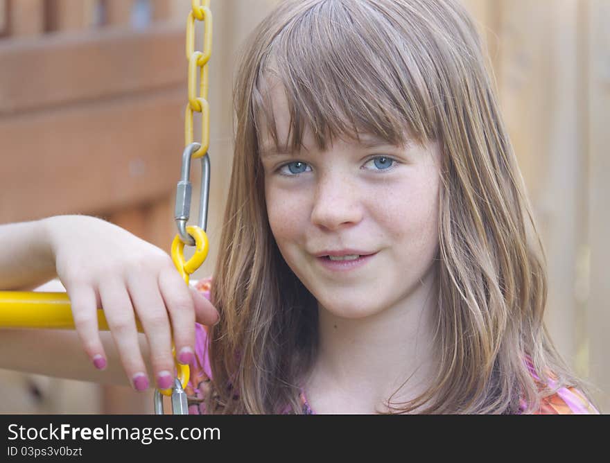 Young teenage girl on a swing