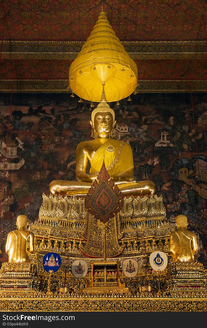 The principal Buddha image is “Phra Buddha Deva Patimakorn” in a gesture of seated Buddha on a three tiered pedestal