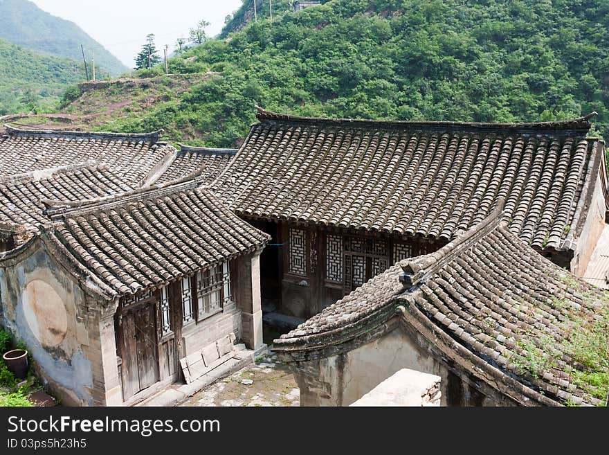 The old brick house of the ancient village in mountains, Beijing, China. The village has 400 years of history. It was built in the Ming Dynasty of China.