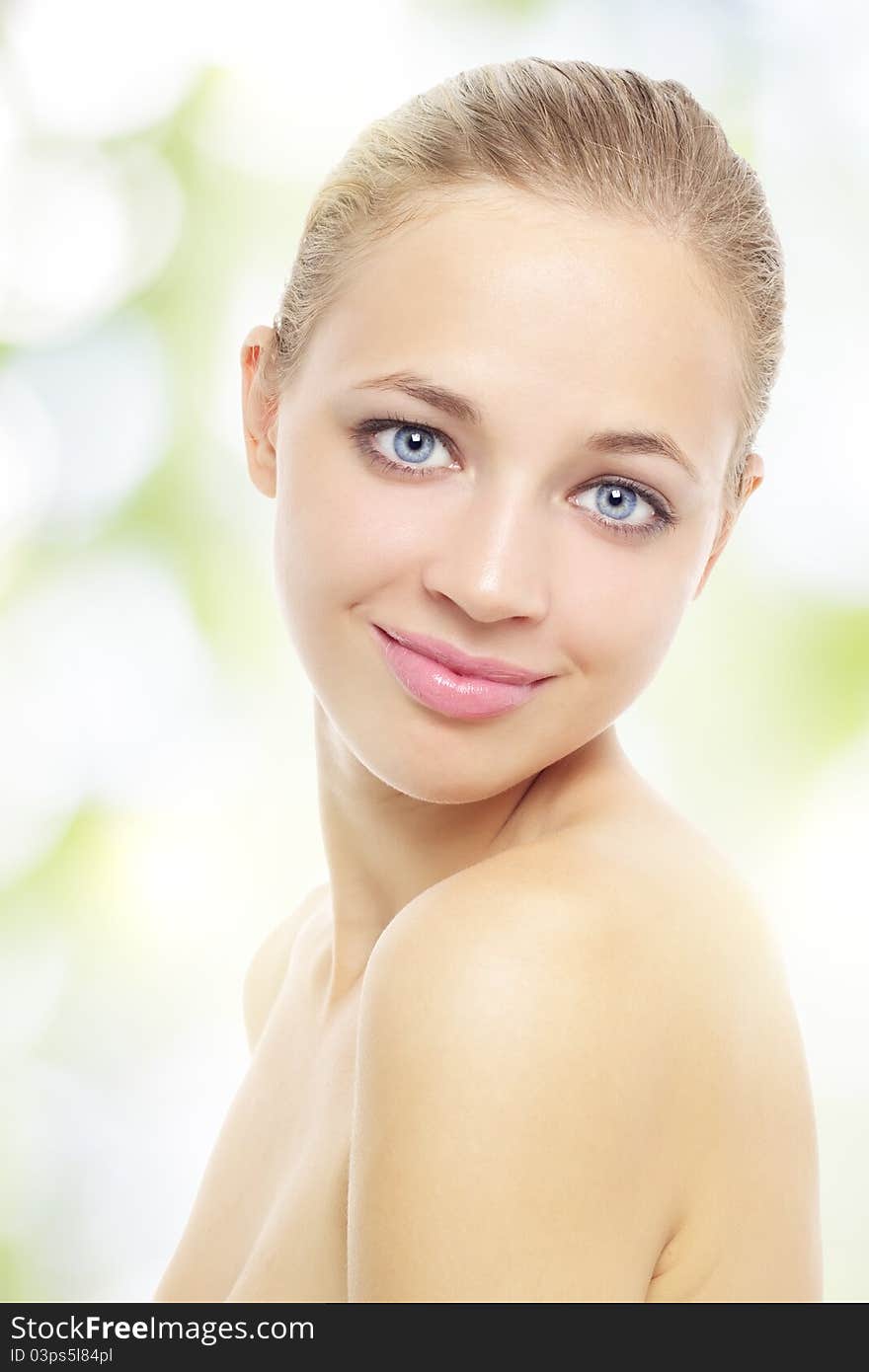 Young healthy woman on a light background