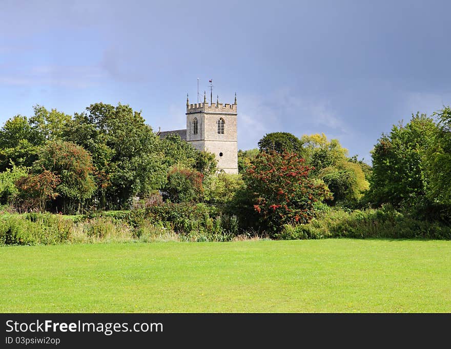 An English Rural Landscape with Village Church Tower between the trees