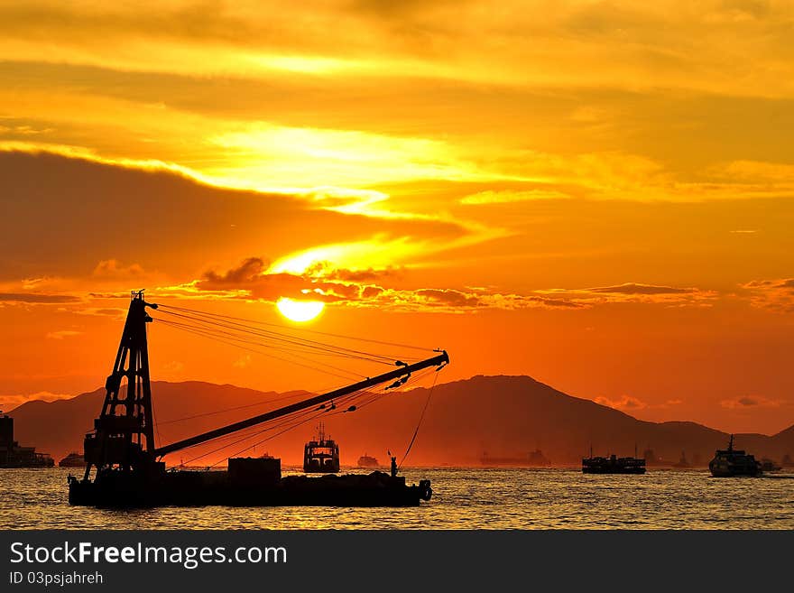 Cargo ship at sunset