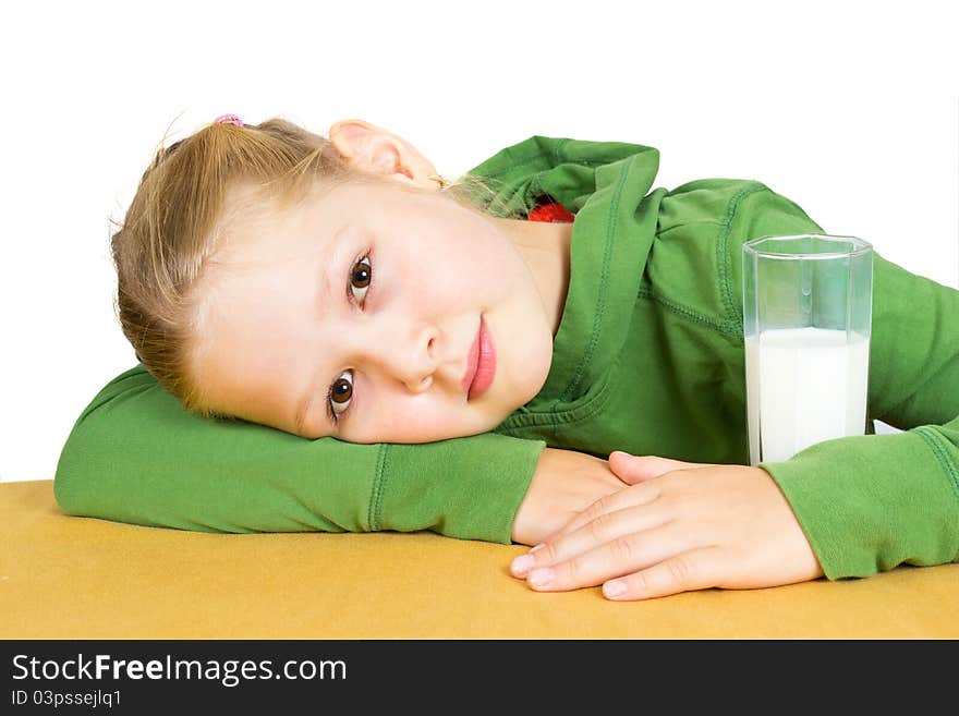 Cute little girl with a glass of milk, isolated over white