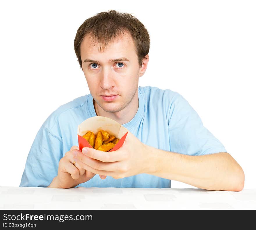 Man eats French fries isolated