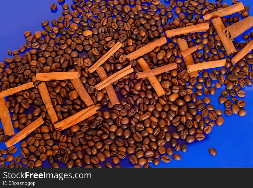 Coffee beans on blue background.