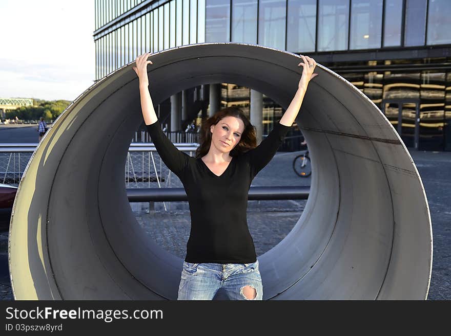 Girl standing inside the metallic pipe. Girl standing inside the metallic pipe