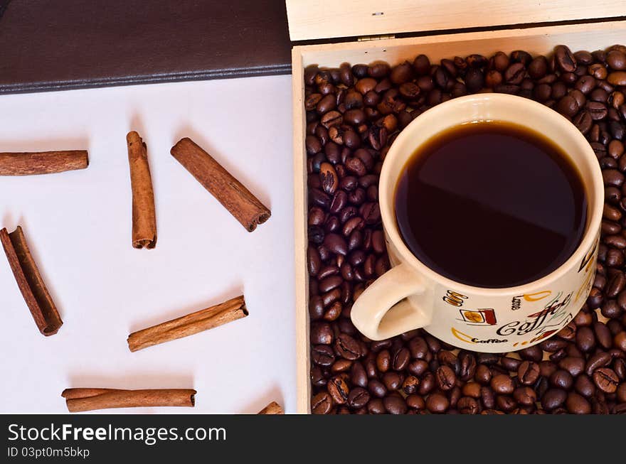 Coffee cup,coffee beans and cinnamon.