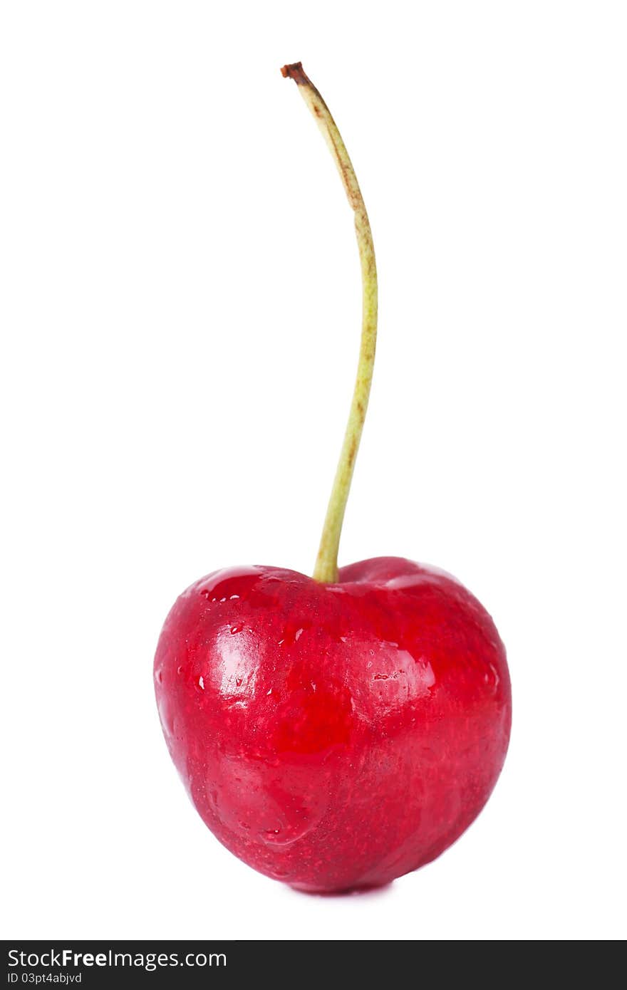 Close up view of heart shaped cherry over white background