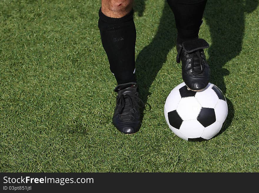 Soccer player with a ball