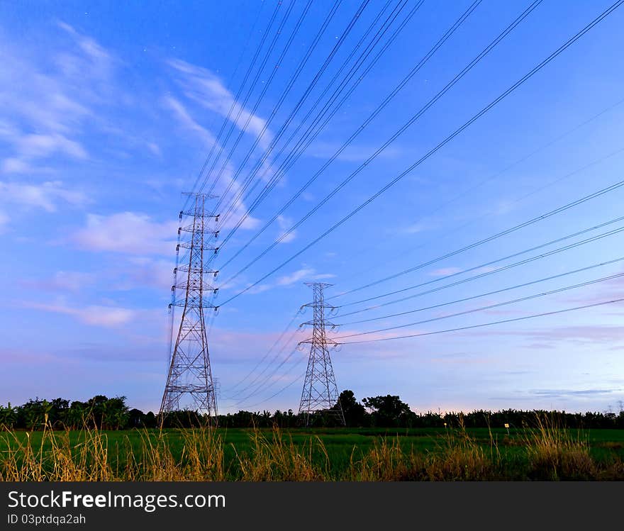 Electric high voltage power post and blue sky