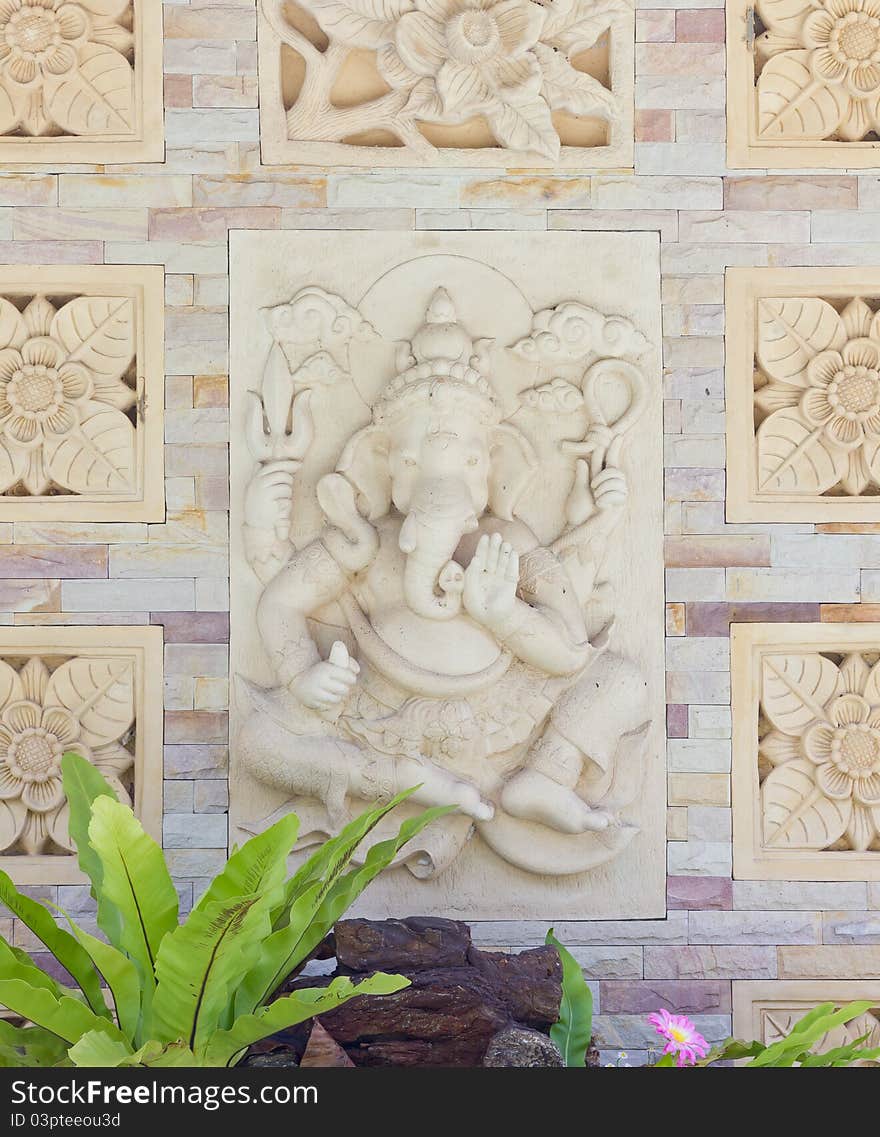 Indian or Hindu God Ganesha avatar image in stucco low relief technique ,Wat Samarn,Thailand.