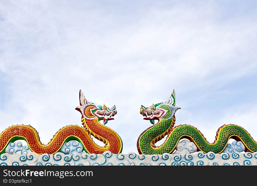 Two thai dragon statue with cloud in the sky, Thailand