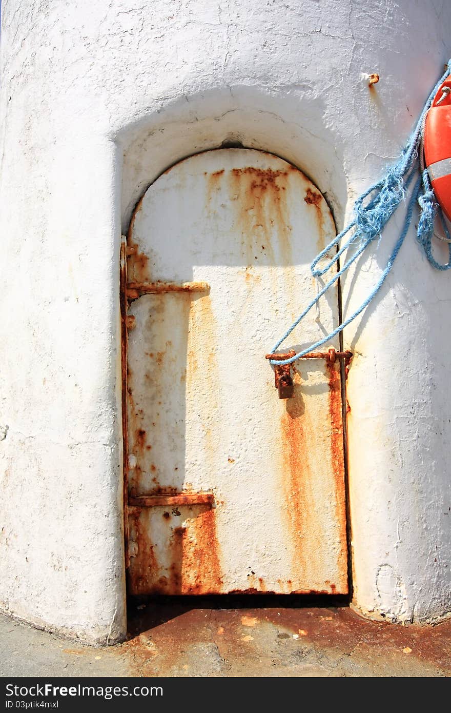 Old, rusty door in the old lightouse in Scotland. Old, rusty door in the old lightouse in Scotland