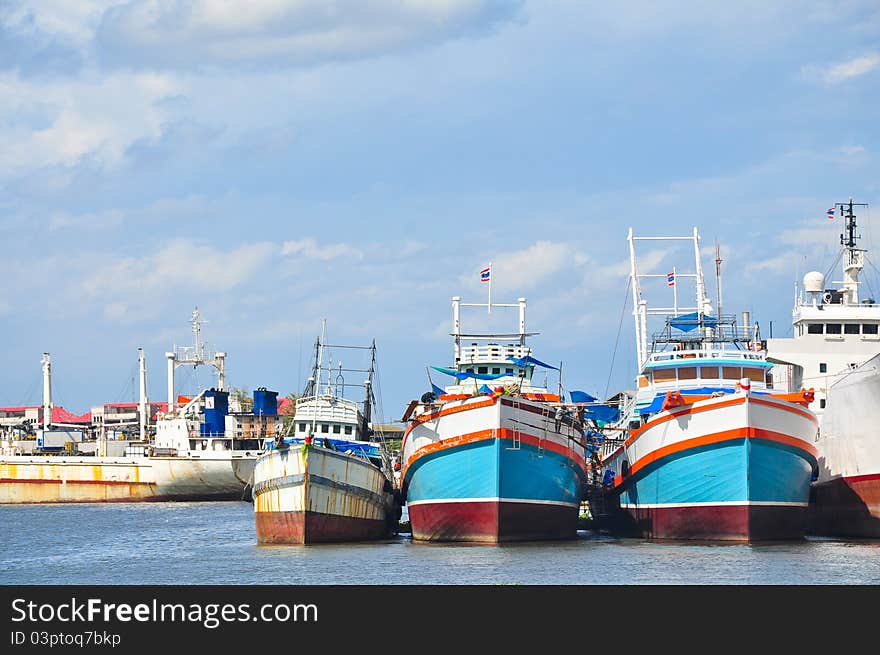 Fishery boat waiting for renovation in a dock, Thailand. Fishery boat waiting for renovation in a dock, Thailand