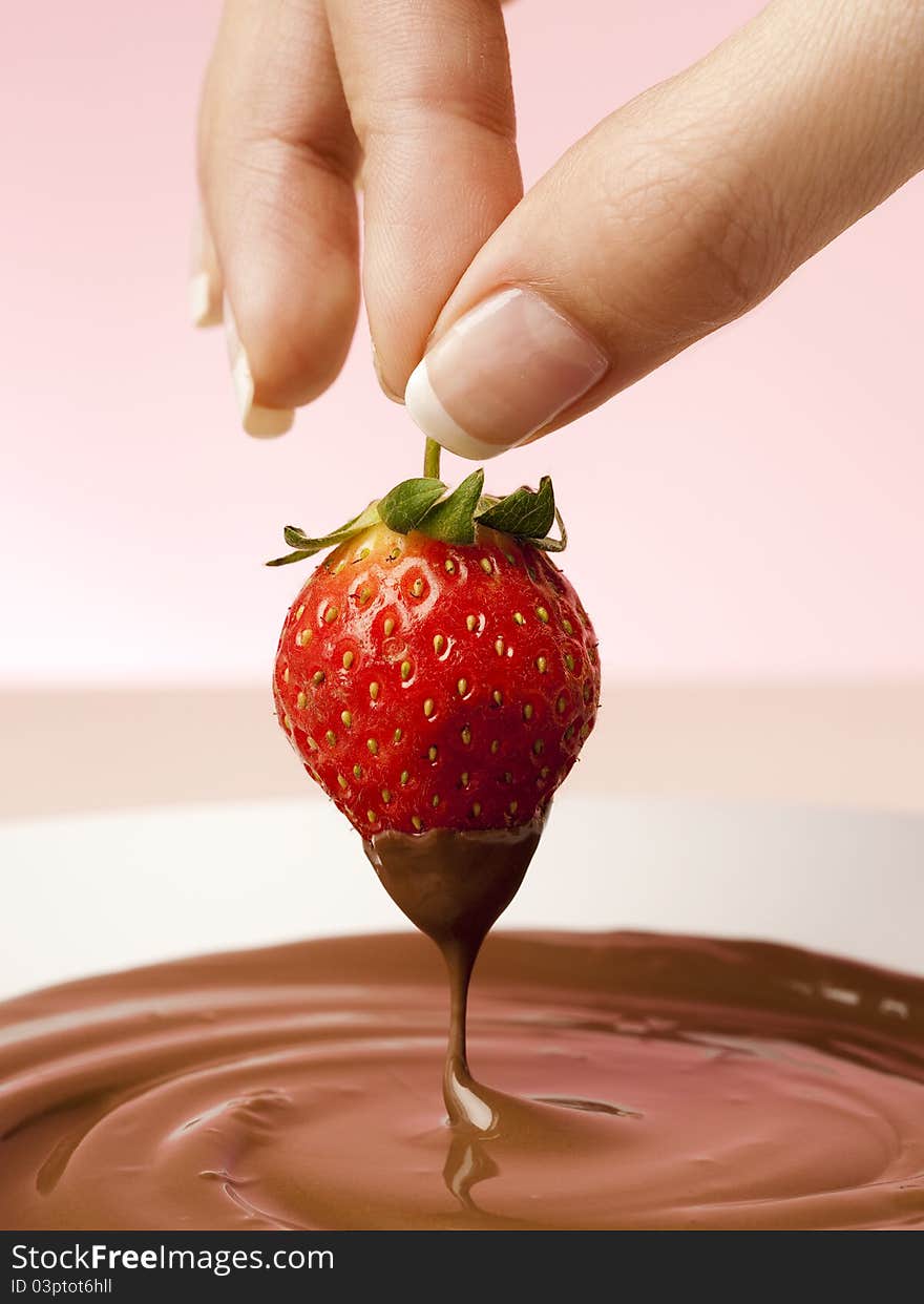 Fresh strawberry dipped in the chocolate melt. Fresh strawberry dipped in the chocolate melt