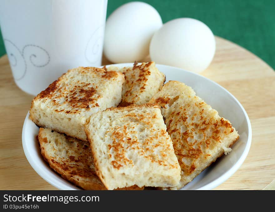 Breakfast with toasts and eggs