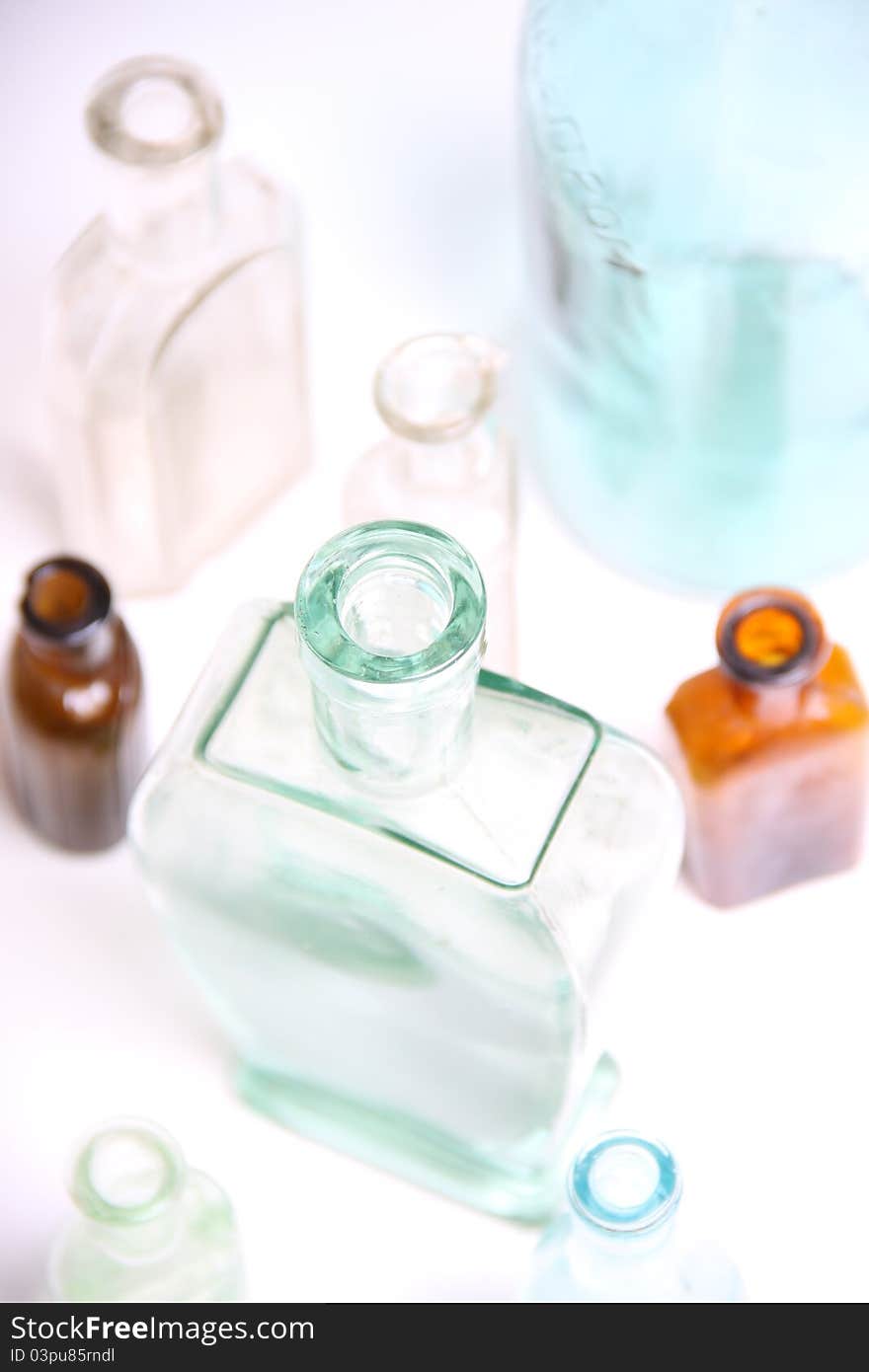 Vintage glass bottles on white