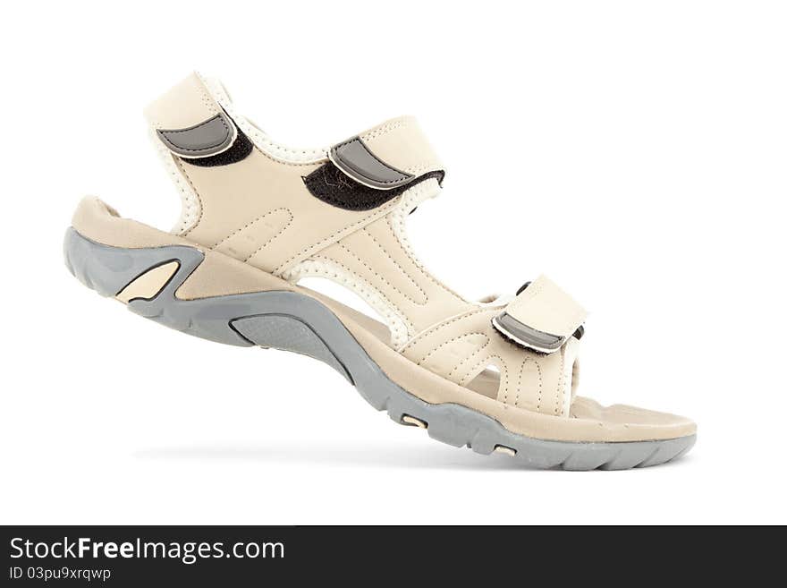 Side view of female travel sandal over white background