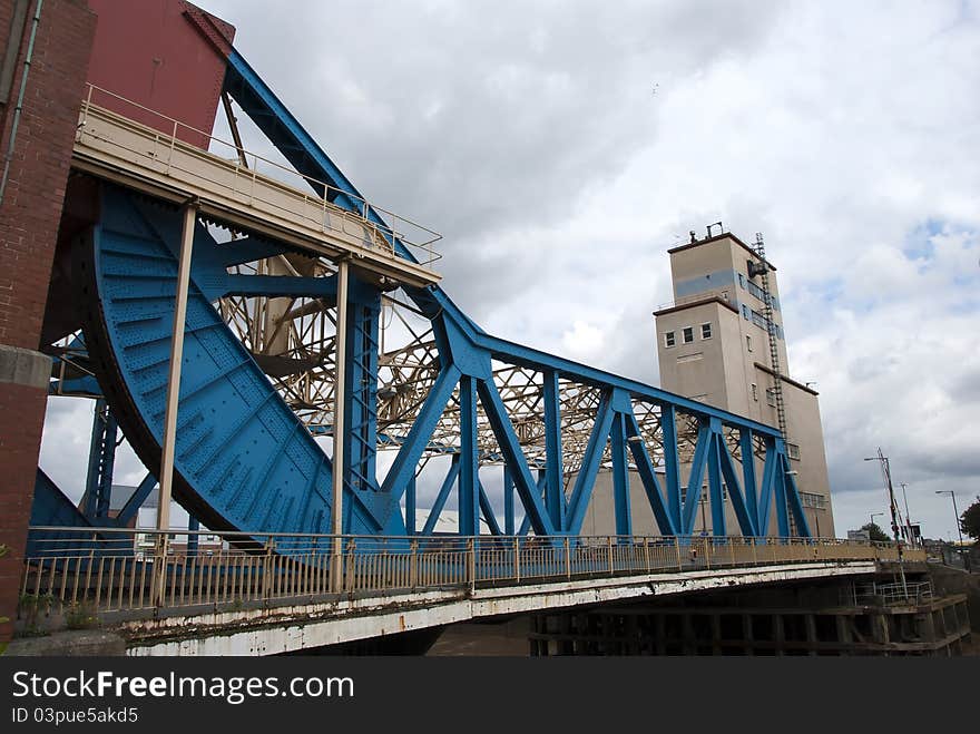 A Blue Girder Lift Bridge over a river in Yorkshire England. A Blue Girder Lift Bridge over a river in Yorkshire England