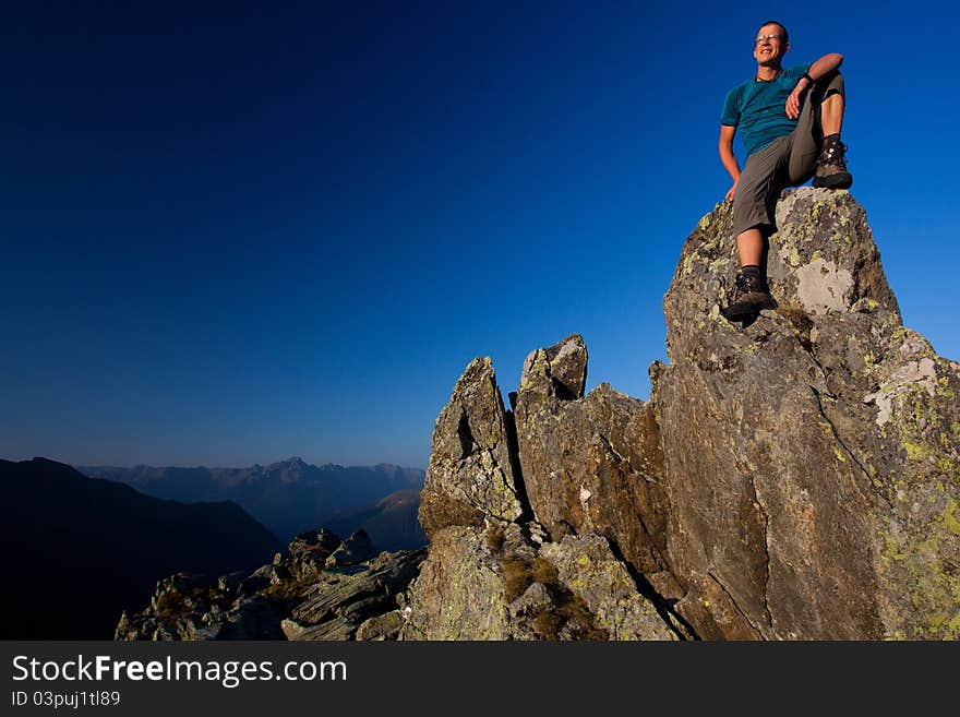 Young man enjoying sunrise in the mountains. Young man enjoying sunrise in the mountains