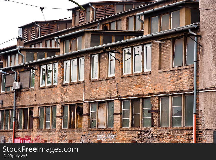 Abandoned industrial building with brick wall