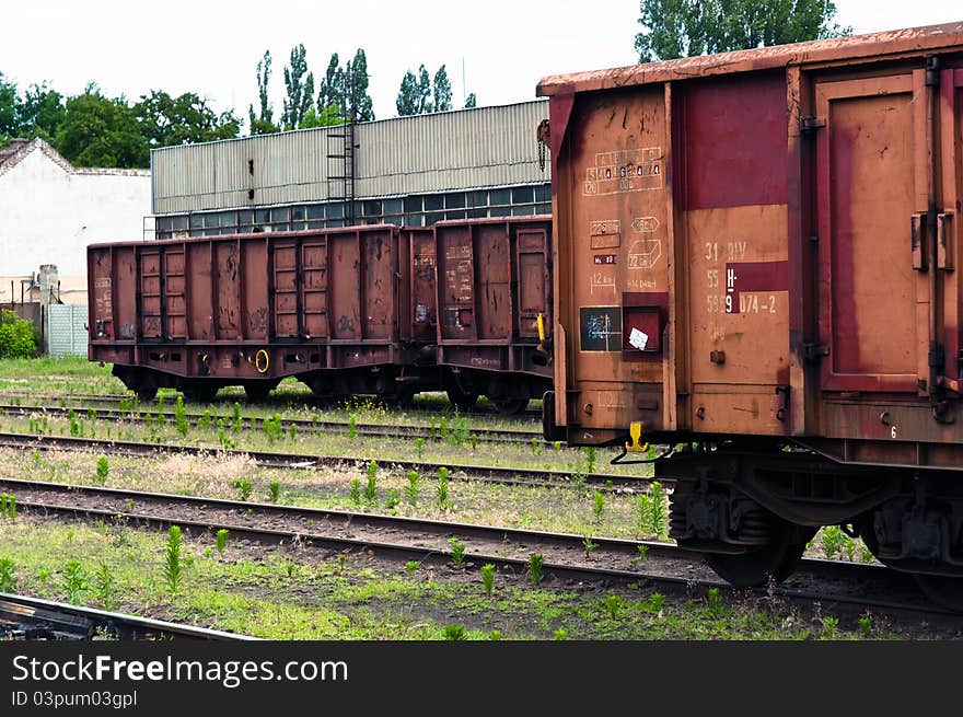 Old trains in a trainyard industrial scene