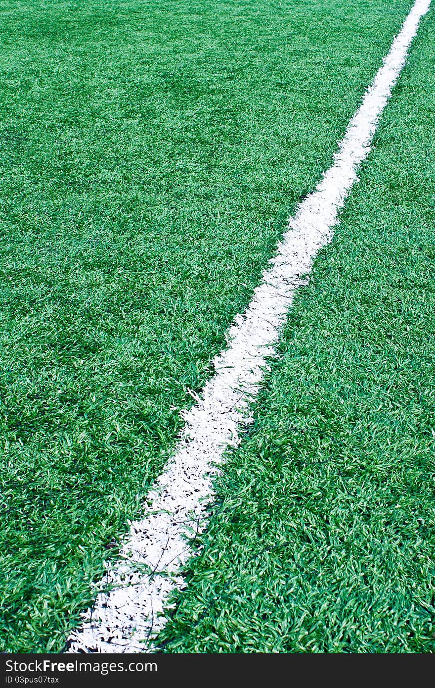 Fake grass soccer field with white line