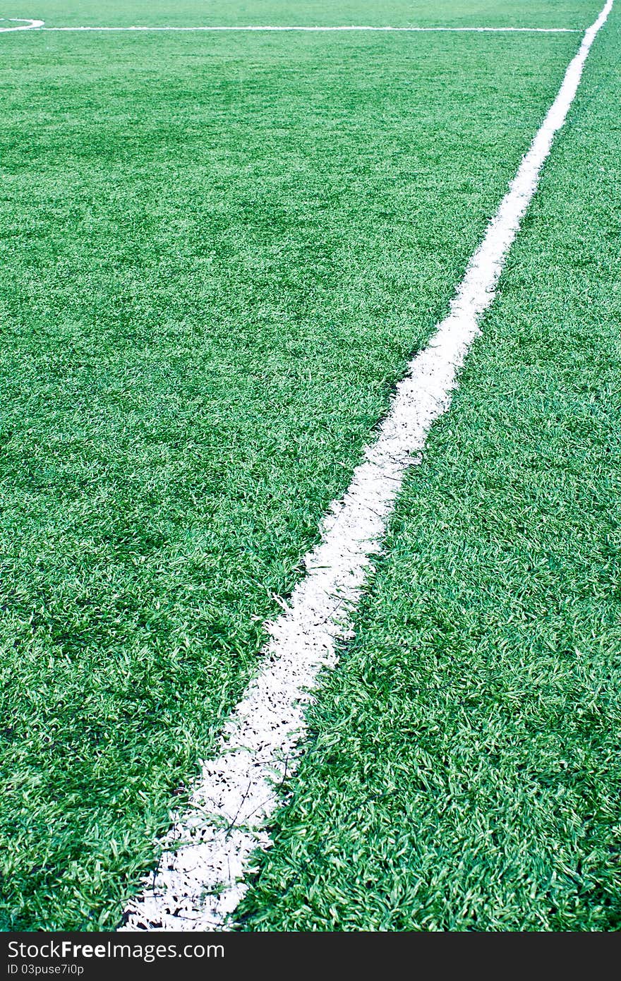 Fake grass soccer field with white line