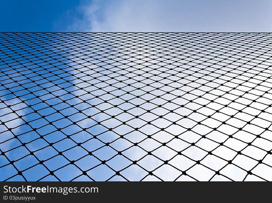 Net in close up view with blue sky. Net in close up view with blue sky