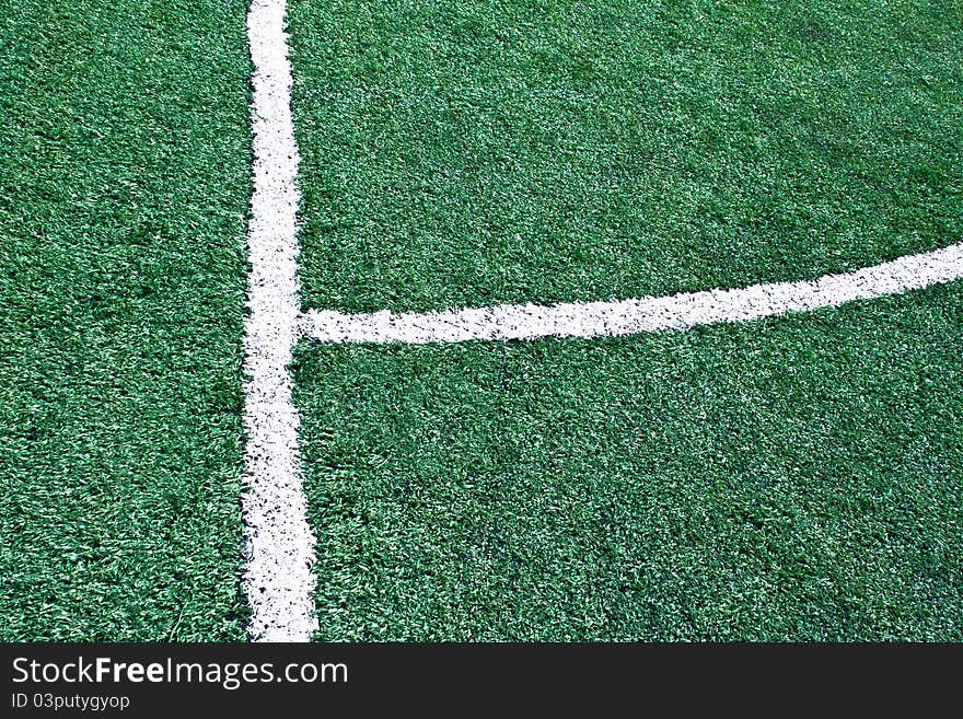 Fake grass soccer field with white line