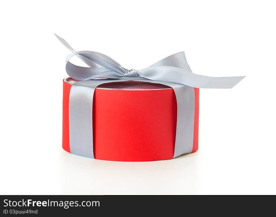 Red gift box with ribbon on a white background. Red gift box with ribbon on a white background