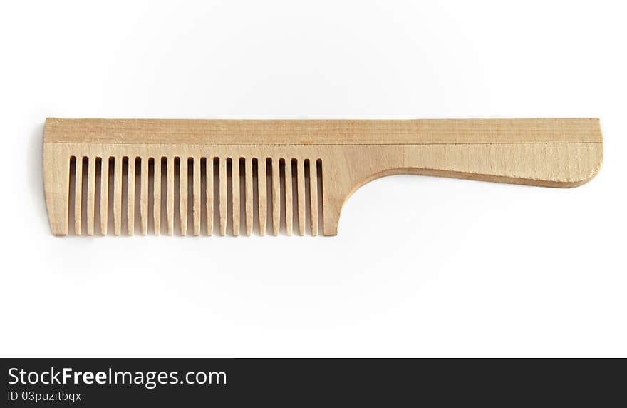 Wooden comb on a white background