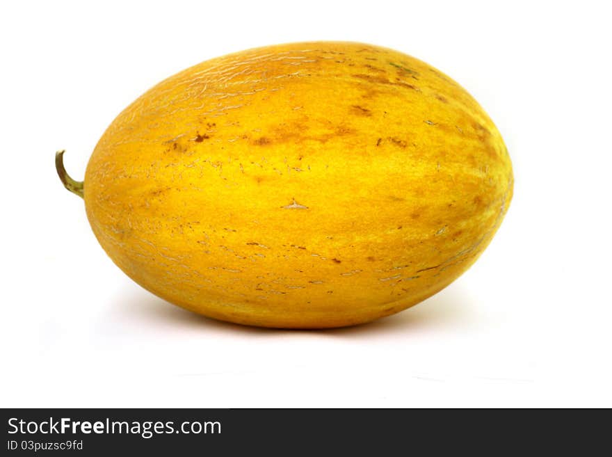 Unsliced full melon fruit close-up, isolated on white background.