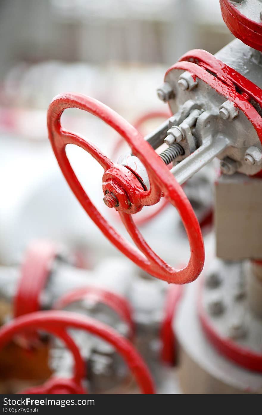 Red valves at the petroleum factory. Red valves at the petroleum factory