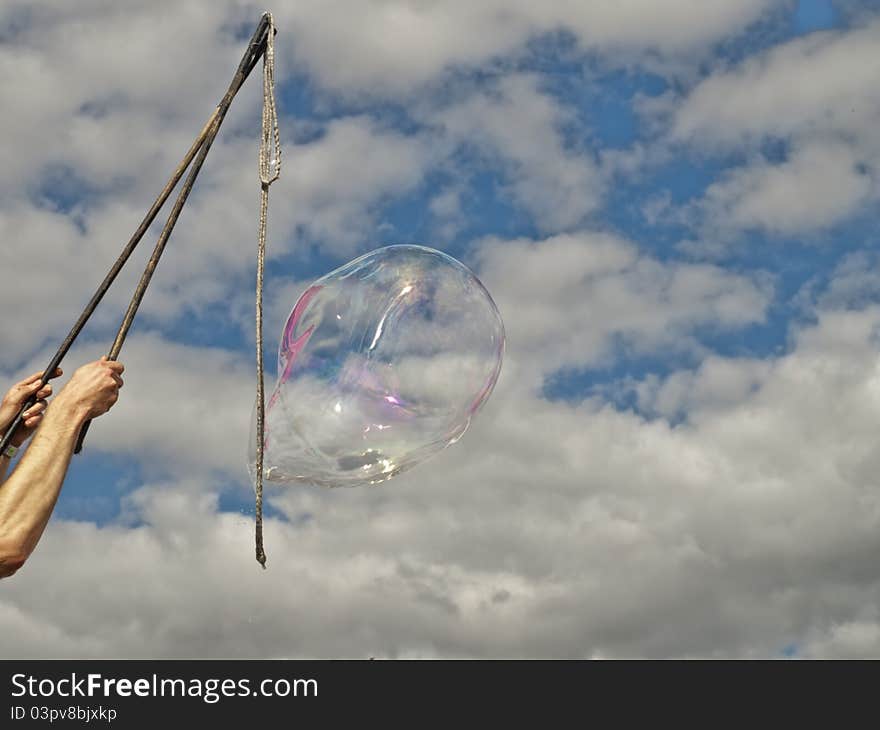 Festival bubble blowing against sky