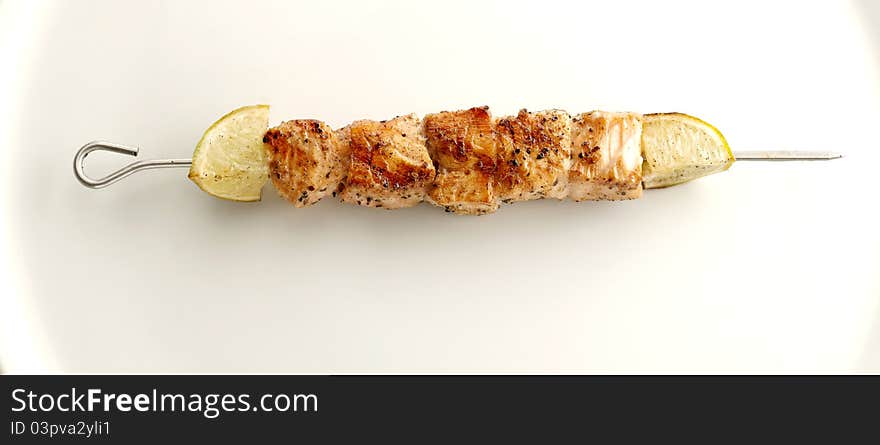 Appetizer fresh fish shashlik with lemon