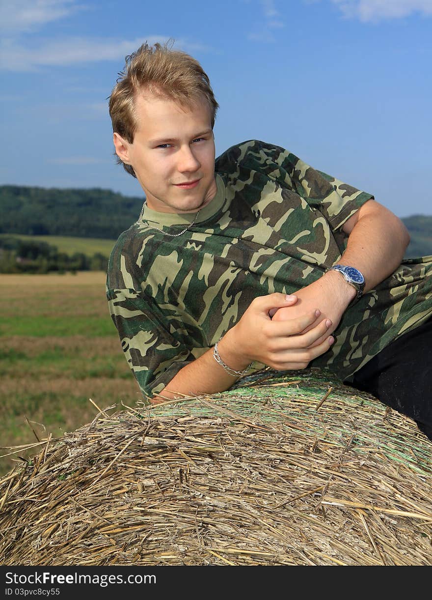 Portrait of a boy on a straw bale. Portrait of a boy on a straw bale