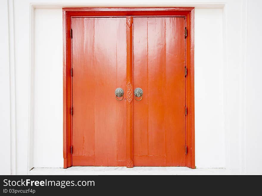 Old thai door with single traditional asian red wooden door closed