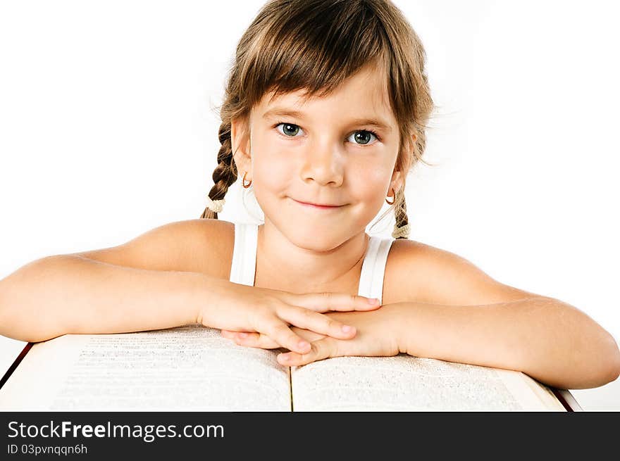 Student girl with a big book isolated on white