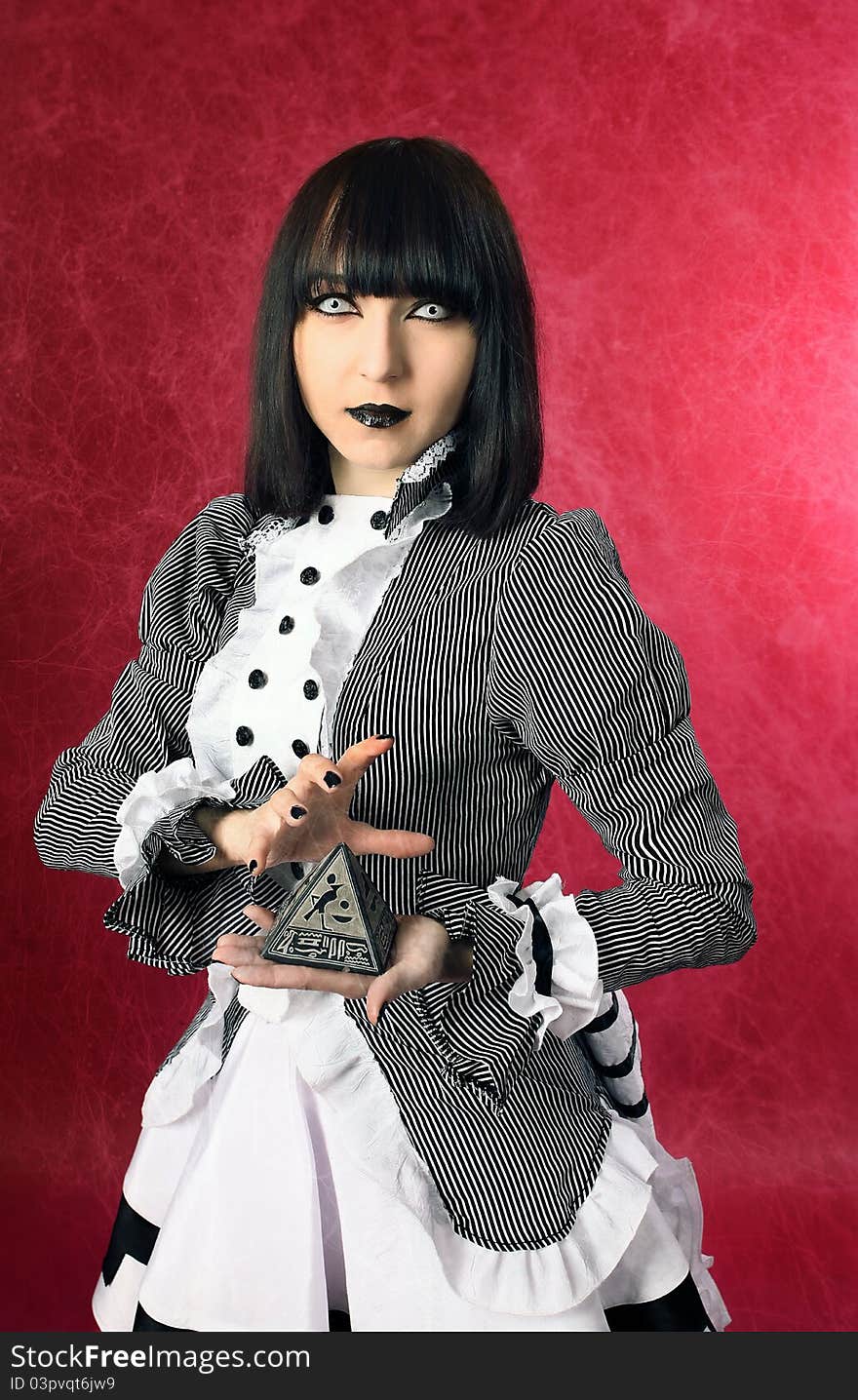 Model in studio with a magic sign in her hands. Model in studio with a magic sign in her hands