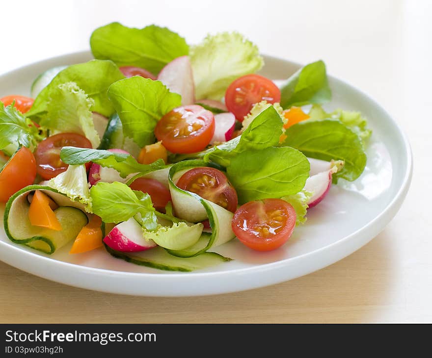 Fresh salad from raw vegetables and lettuce