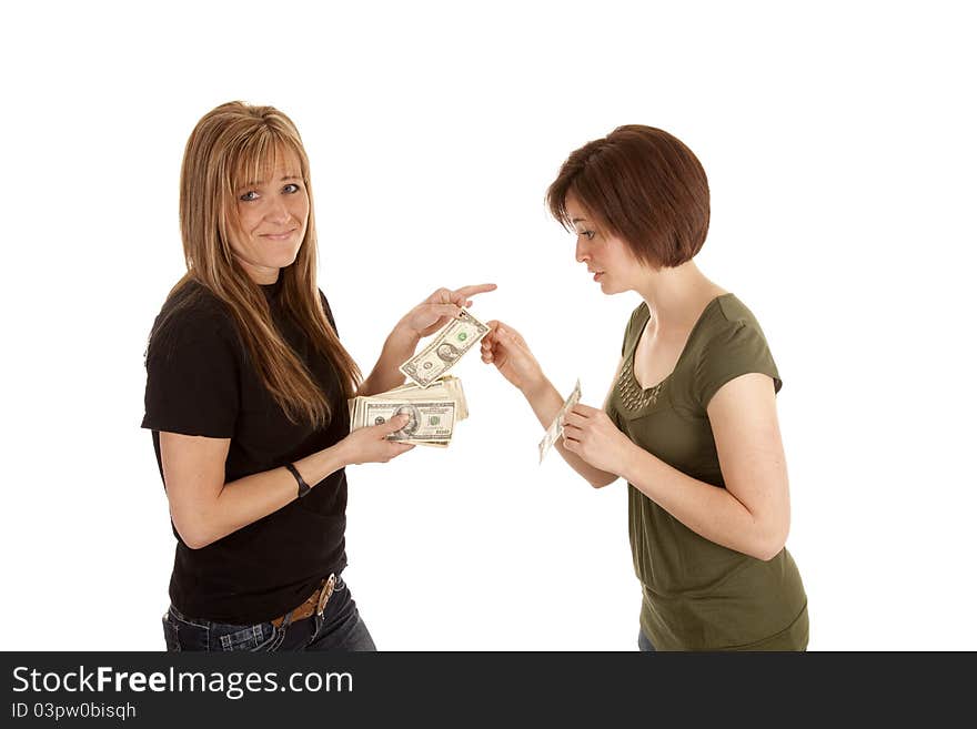 A women giving another women a dollar with a smug look in her face. A women giving another women a dollar with a smug look in her face.