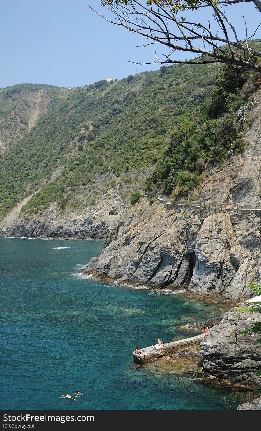 Rocky coastal path between Manorola and Corniglia two of the Italian Cinque Terre villages and a UNESCO world heritage site. Rocky coastal path between Manorola and Corniglia two of the Italian Cinque Terre villages and a UNESCO world heritage site.