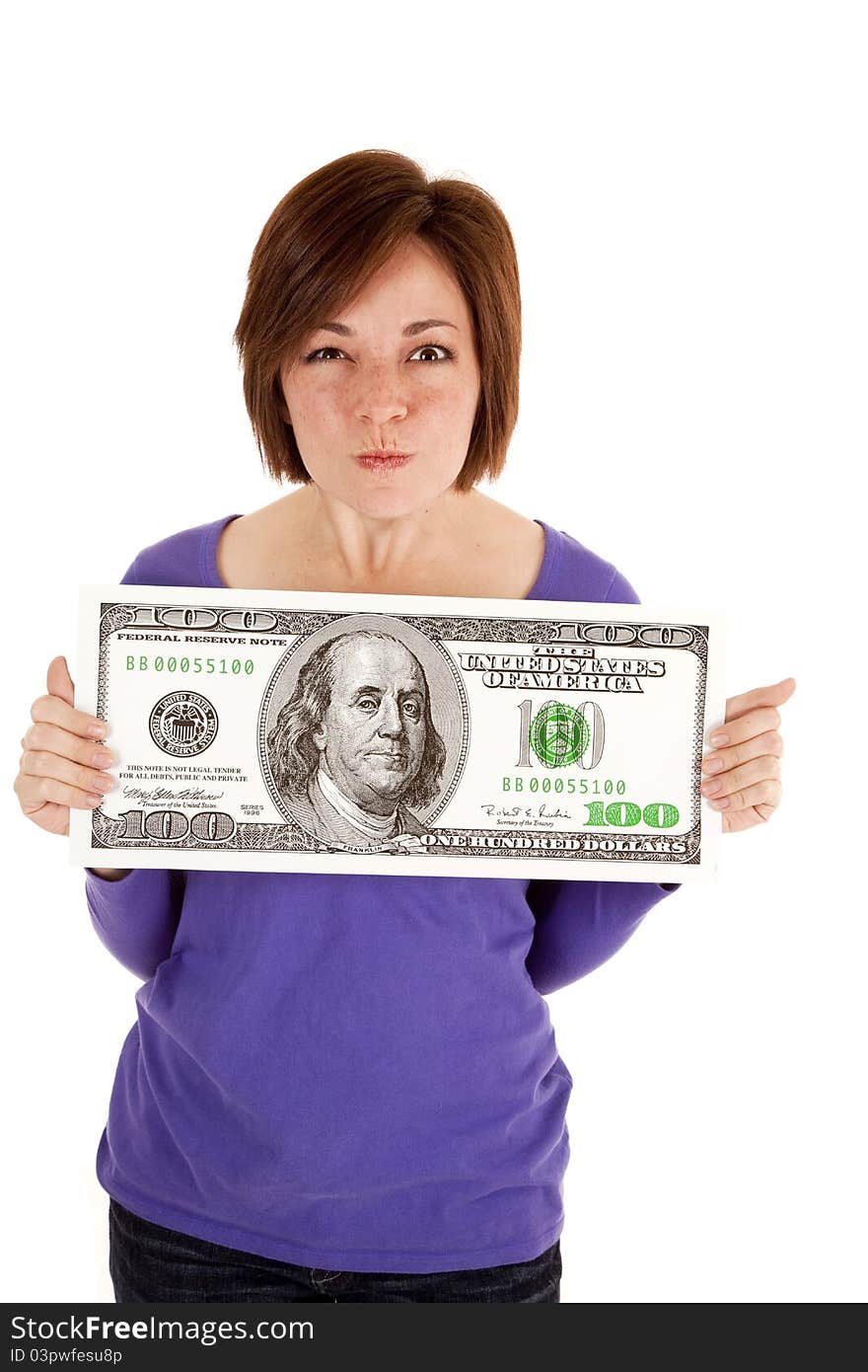 A woman holding a big dollar in her hands with an upset expression on her face. A woman holding a big dollar in her hands with an upset expression on her face.